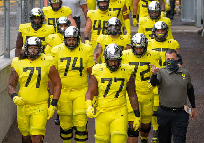 Mario Cristobal and the offensive line walking into battle against Oregon State.